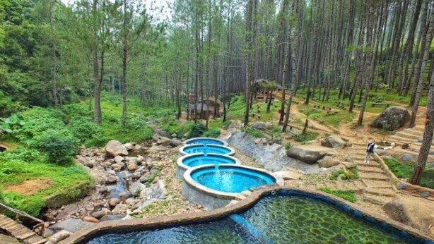A natural hot spring area with multiple circular pools surrounded by forest. - OYO 2922 Wisma Kampoeng Ciherang Syariah (Sumedang)