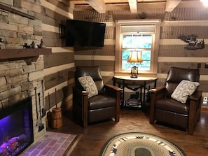 Smart TV, fireplace, books