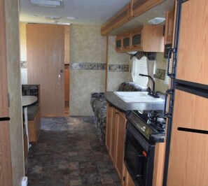 Fridge, microwave, stovetop, coffee/tea maker