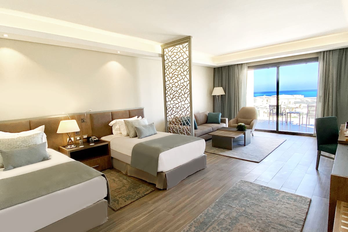 suite, 2 single beds, sea view | 1 bedroom, free minibar, in-room safe, desk