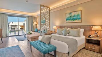 Suite, 1 King Bed with Sofa bed, Garden View | 1 bedroom, free minibar, in-room safe, desk