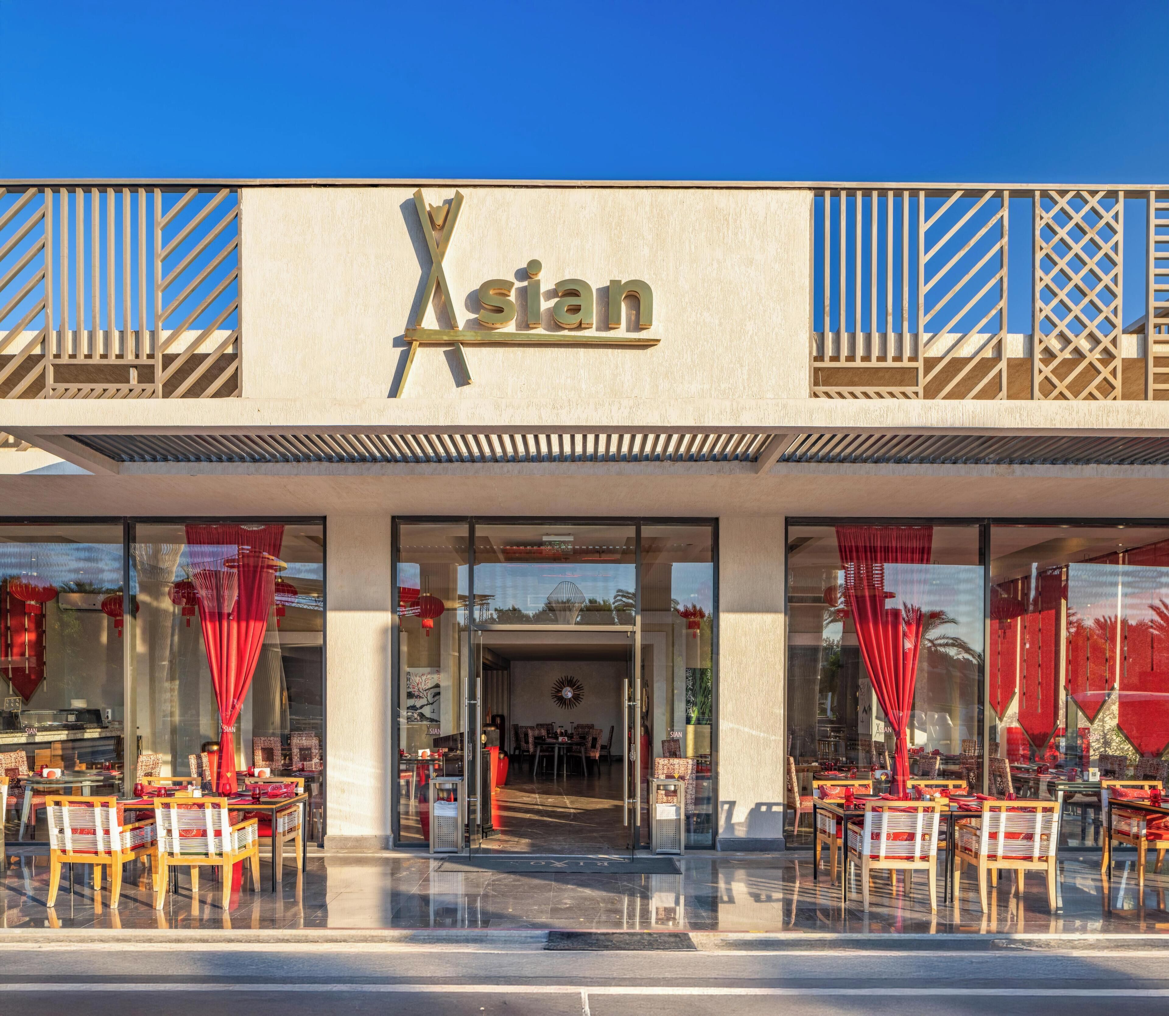 A storefront with a sign reading 'Asian' and a glass entrance.