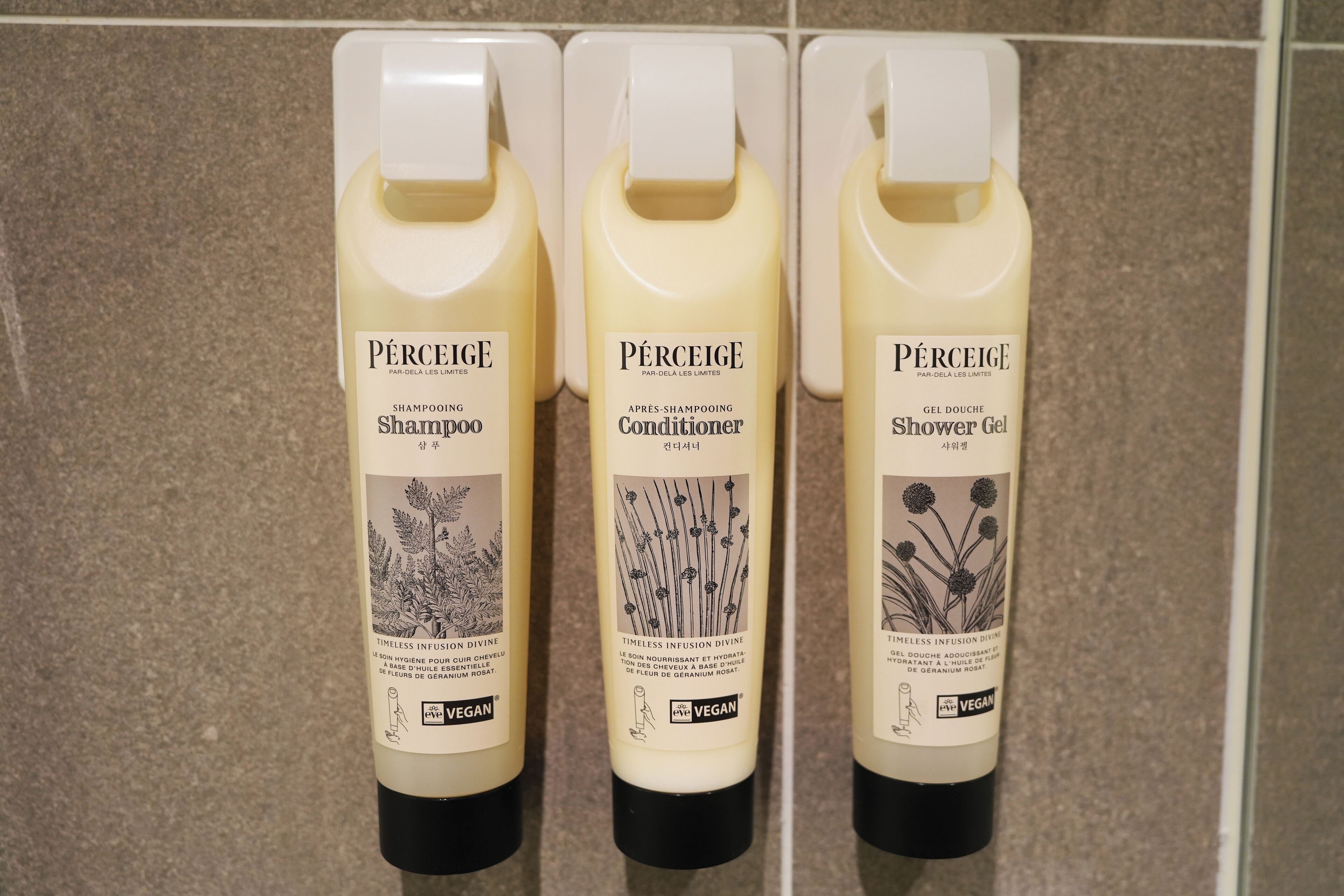 hair dryer, slippers, bidet, towels