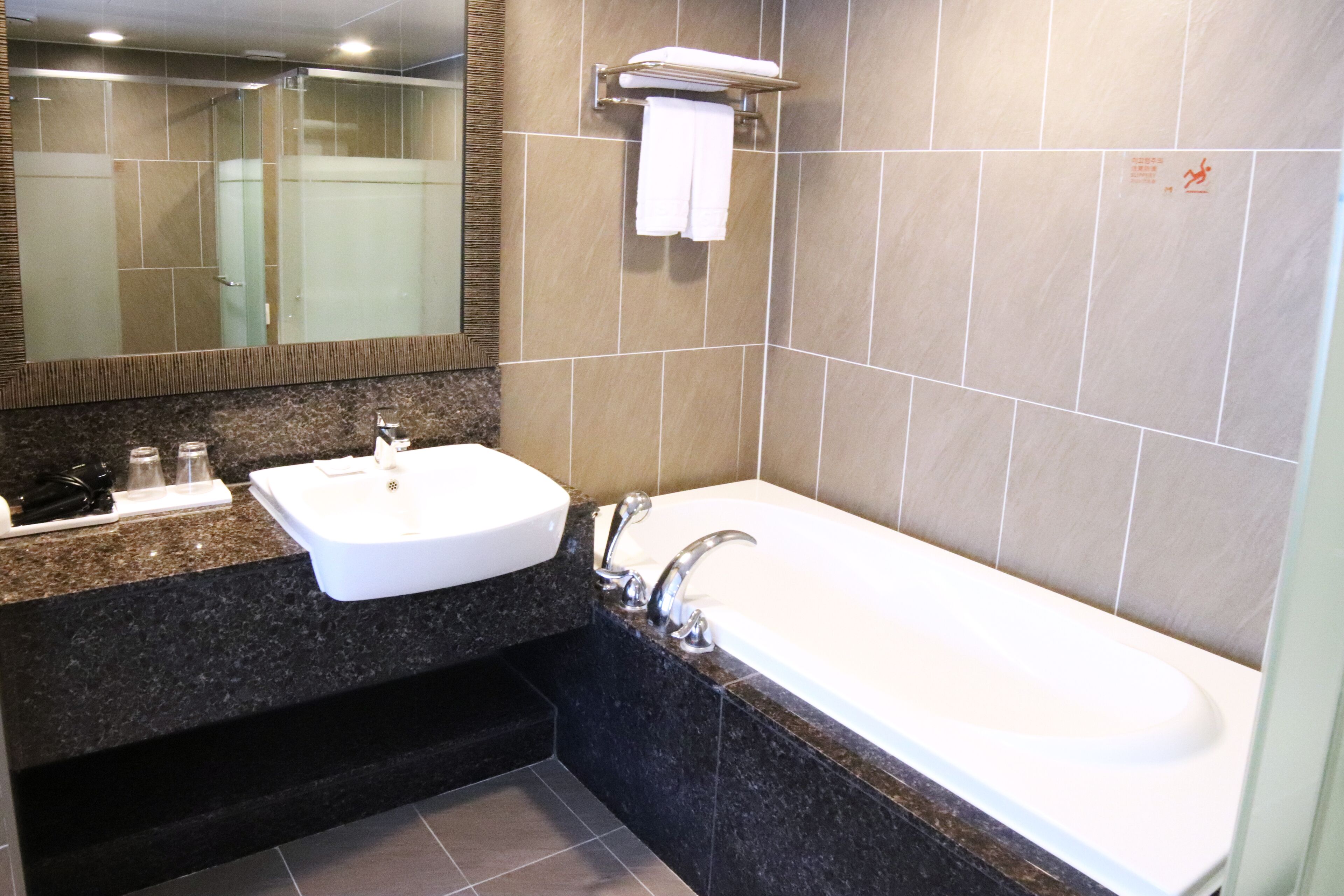 the m ondol suite | bathroom | shower, hair dryer, slippers, bidet