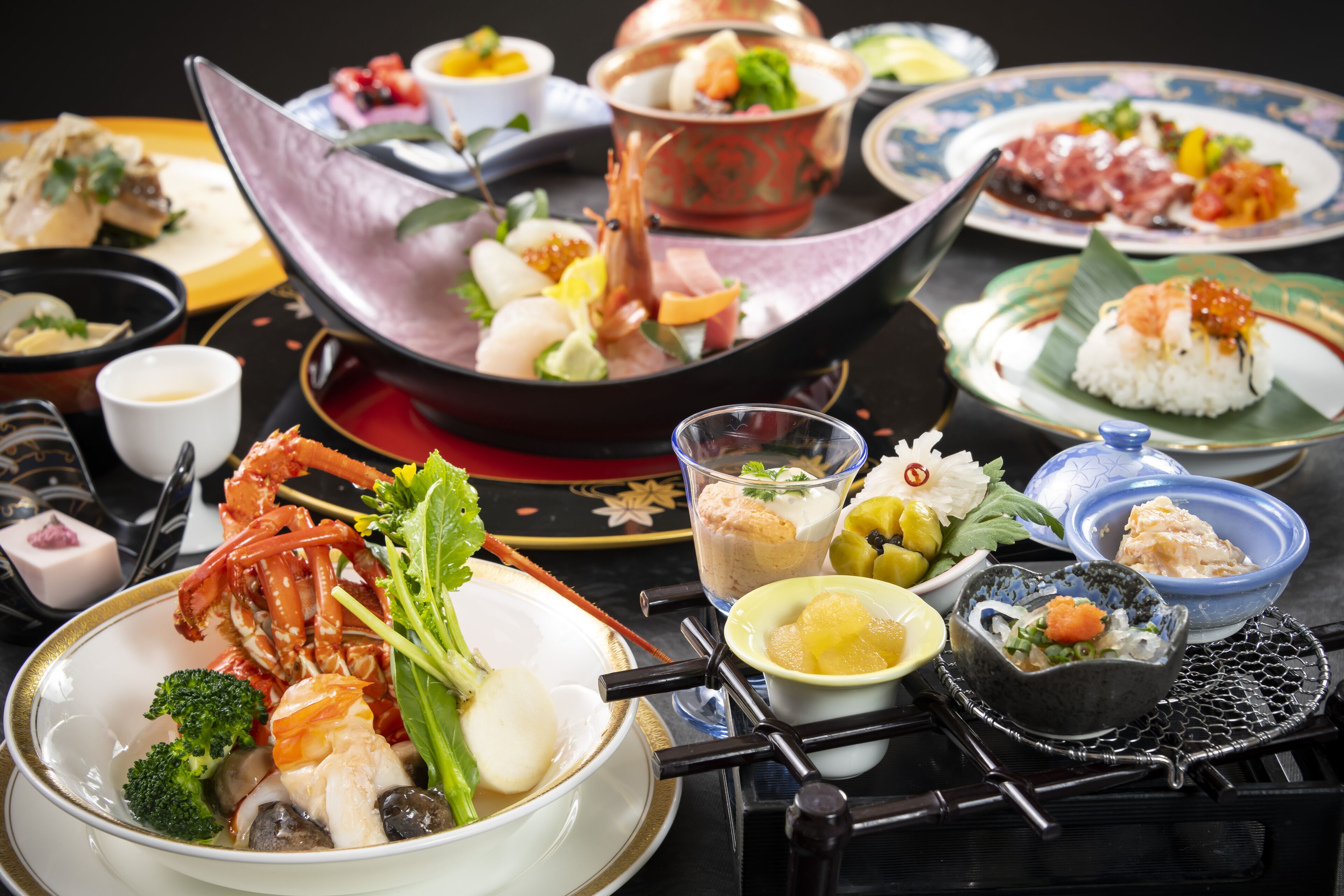 A variety of dishes on a table, including seafood, rice, and vegetables.