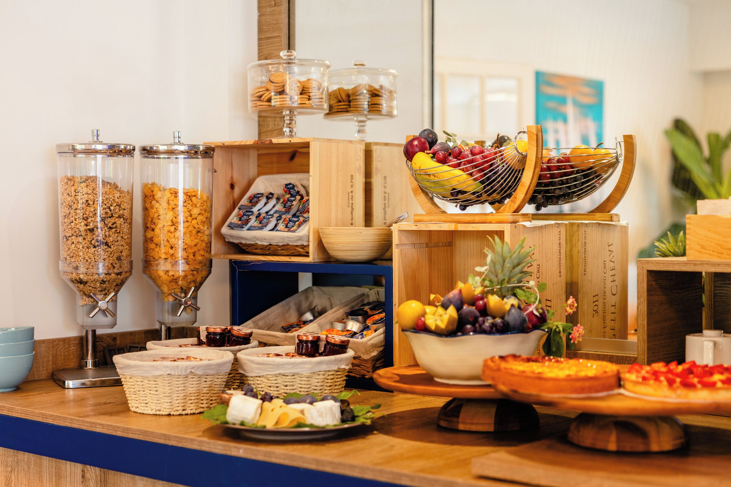 A buffet setup with various food items and condiments.