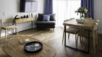 Deluxe suite | Woonruimte | Flatscreentelevisie