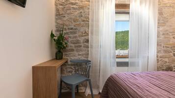 2 slaapkamers, een strijkplank/strijkijzer, beddengoed