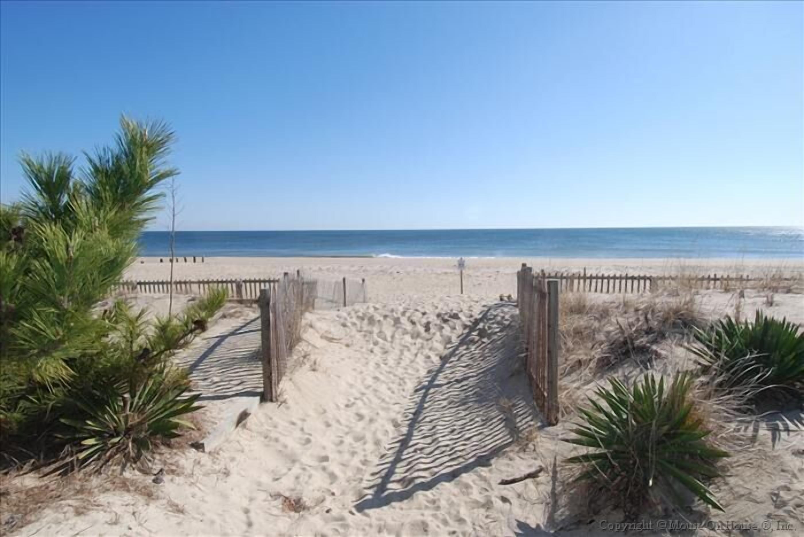 FREE ACTIVITIES!!!!  Located just steps from the beach this 4 bedroom, 3 bath multi-level townhouse sits perpendicular to the ocean with partial views.