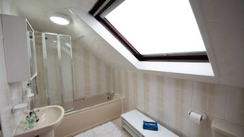 Combined shower/bathtub, hair dryer, towels, soap