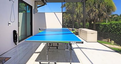 Modern home w/ outdoor kitchen & steps to beach