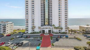 A high-rise hotel with multiple floors, a central courtyard, and a view of the ocean. - 🌊Breathtaking Ocean ViewsLuxury Penthouse-Daytona Ashley Penthouse 4🌊 (Daytona Beach Shores)
