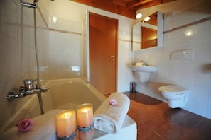 Family Townhome, Multiple Beds, Garden Area (Casa Di Claes) | Bathroom | Combined shower/tub, rainfall showerhead, hair dryer, bidet
