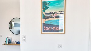 A dining area with a wooden table set for breakfast, including croissants, orange juice, and coffee. - Port Ste-Marine: L'Escale - Balconies & Small view (Combrit)