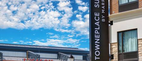 A sign for TownePlace Suites by Marriott and Lucas Oil Stadium.