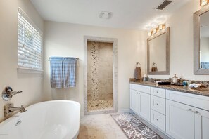 Combined shower/tub, hair dryer, towels, soap