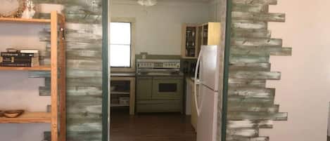 Fridge, microwave, coffee/tea maker, cookware/dishes/utensils