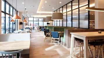 Breakfast, lunch served; international cuisine, al fresco dining