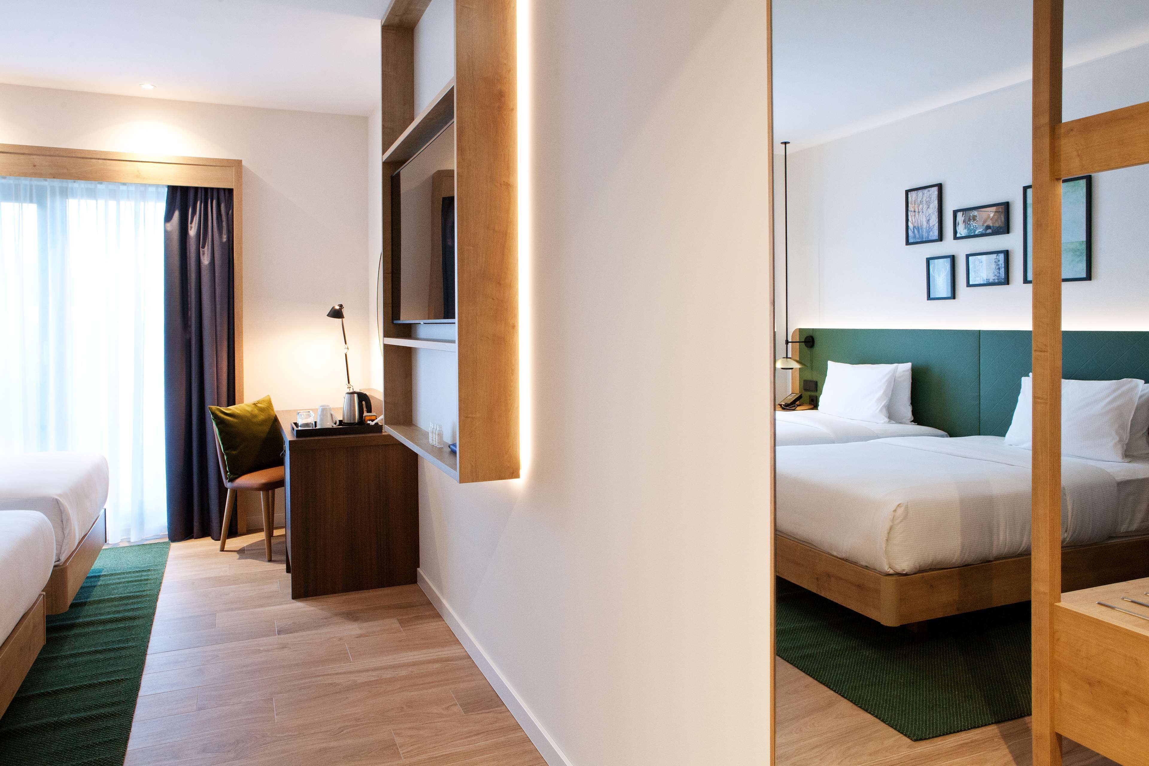 room, 2 single beds | in-room safe, desk, laptop workspace, blackout curtains