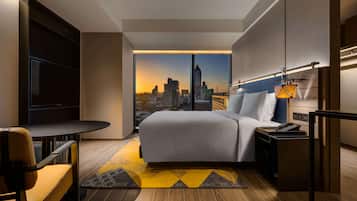 Deluxe Room, 1 King Bed | Minibar, in-room safe, laptop workspace, blackout drapes