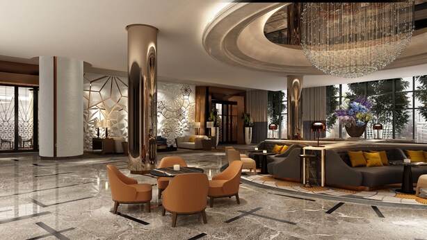 A modern lobby with a marble floor, a central seating area with sofas and chairs, a large chandelier, and a view through large windows.