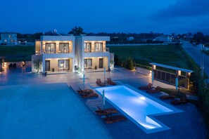 Seasonal outdoor pool, pool umbrellas, pool loungers