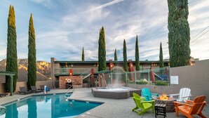 A pool area with a hot tub, outdoor seating, and tall trees. - Uptown King Dog Friendly w/ Private Patio  and  Mountain View @ The Matterhorn Inn (Sedona)