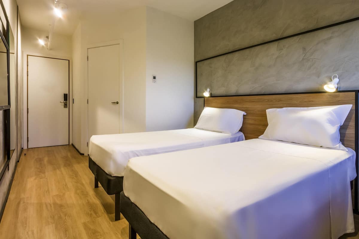 Appartement, 2 lits une place | Bureau, rideaux occultants, chambres insonorisées, Wi-Fi gratuit