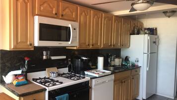 Microwave, coffee/tea maker, cookware/dishes/utensils