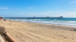 A beach with a pier extending into the ocean. - Direct Oceanfront 2 Bedroom 2 Bathroom on the 1st Floor (Imperial Beach)