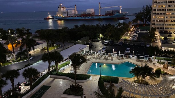 A hotel pool area with a view of the ocean and a cargo ship in the distance. - Modern Oceanfront Hideaway, Ship Views & Steps to the Sand. Fort Lauderdale (Fort Lauderdale)