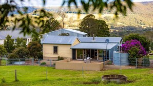 A house with a large patio, a satellite dish, and a view of the surrounding hills. - The Dairy @ Cavan, Kangaroo Valley, Stunning Views (Barrengarry)