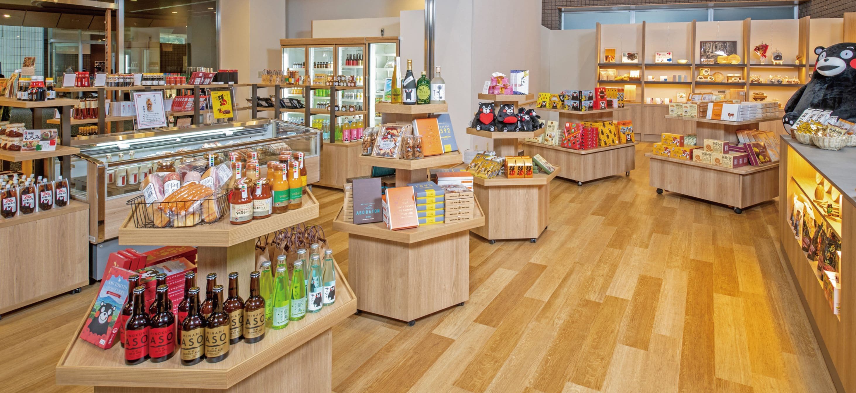 A well-organized store with various products on display, including bottles and boxes.