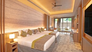 A hotel room with two beds, a ceiling fan, a seating area with chairs, and a large window. - Kamenoi Hotel Aso (Aso)