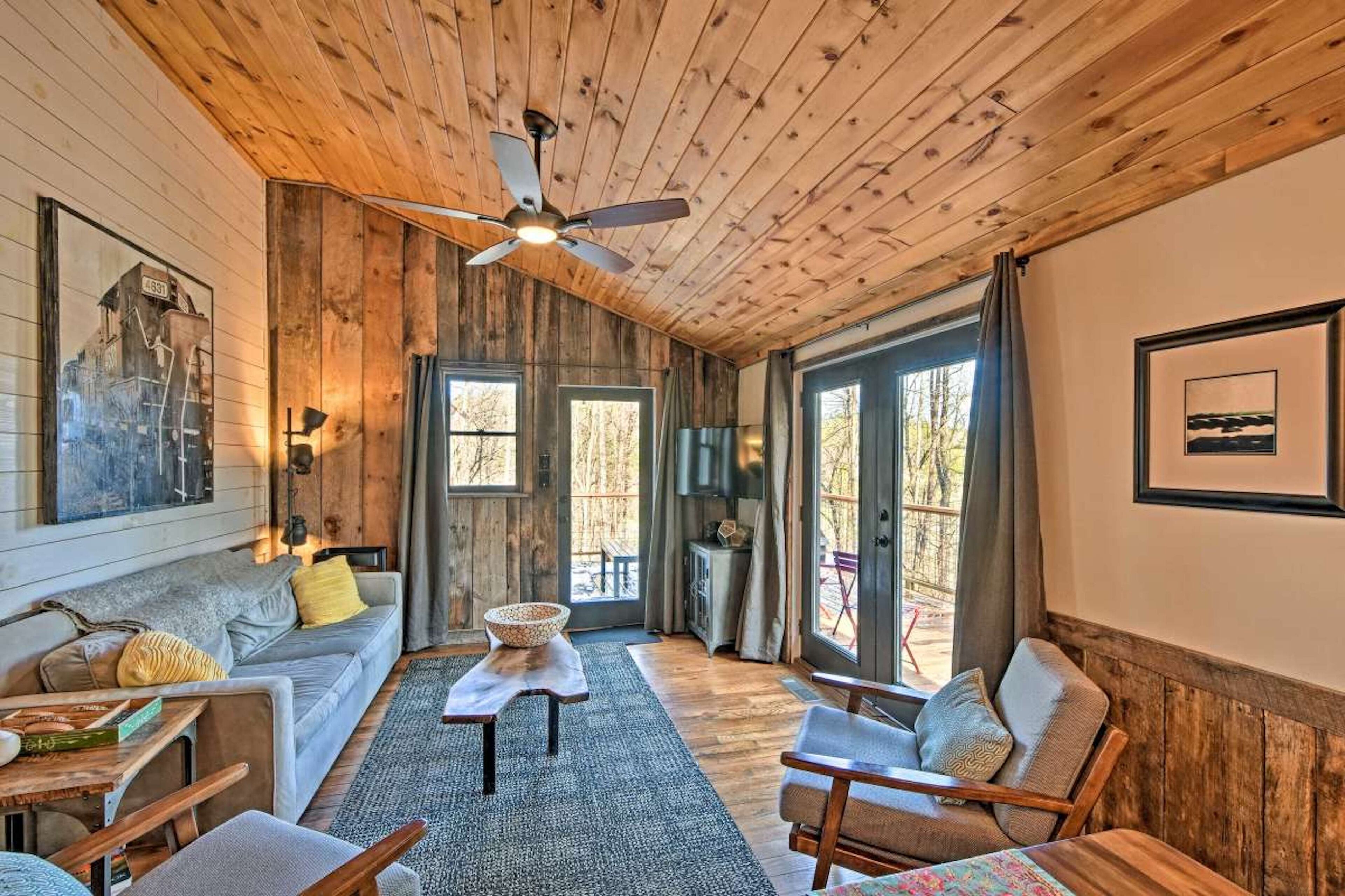 Tranquil & elegant riverfront cabin with private hot tub, large deck, & fire pit
