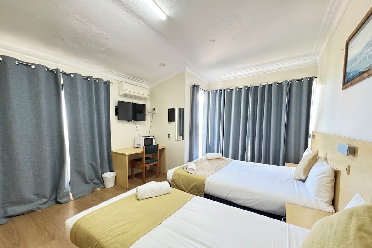 Premium bedding, individually furnished, desk, laptop workspace