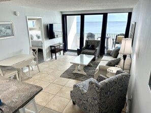 Flat-screen TV, DVD player, books