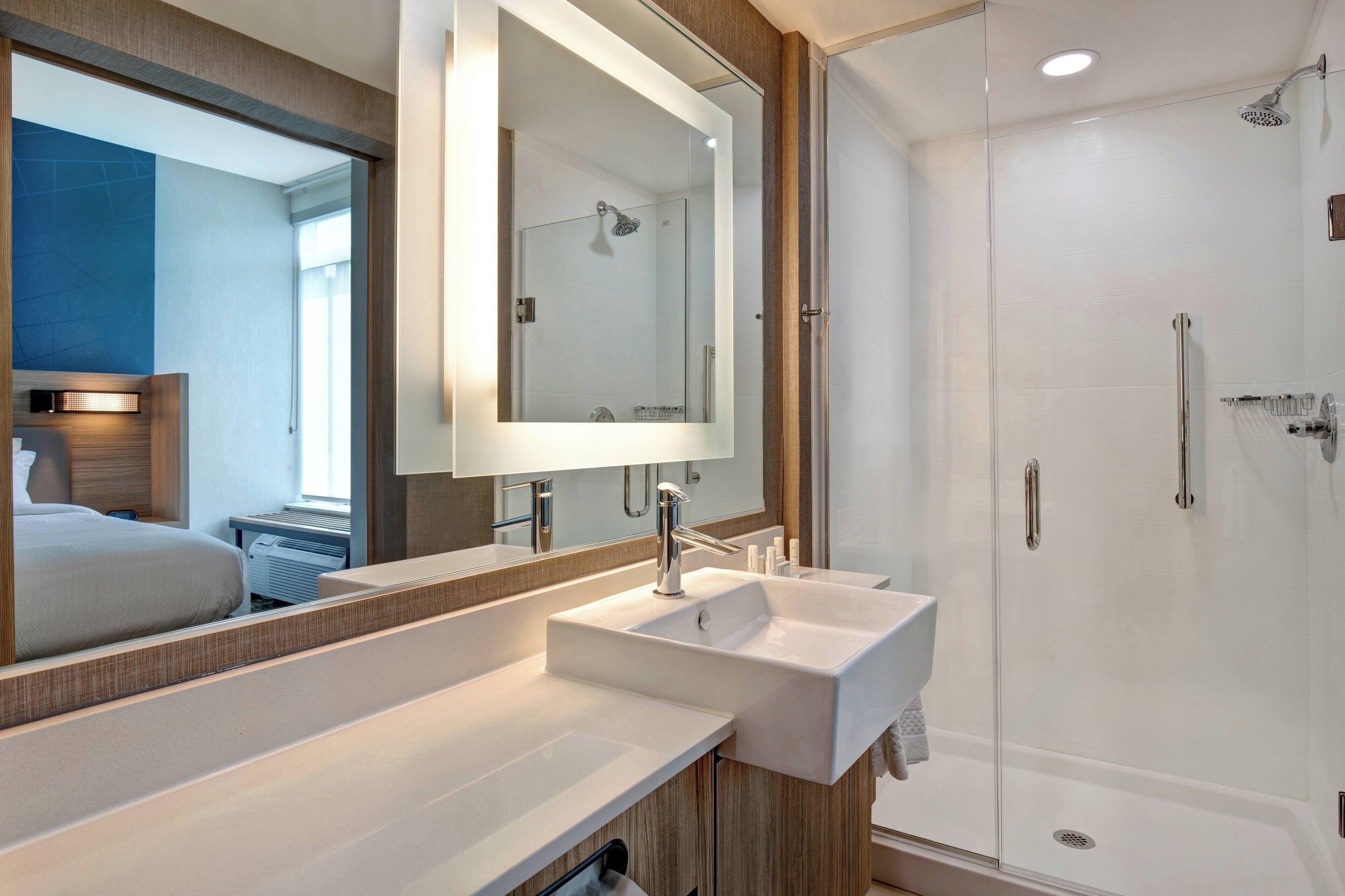 designer toiletries, hair dryer, towels, soap