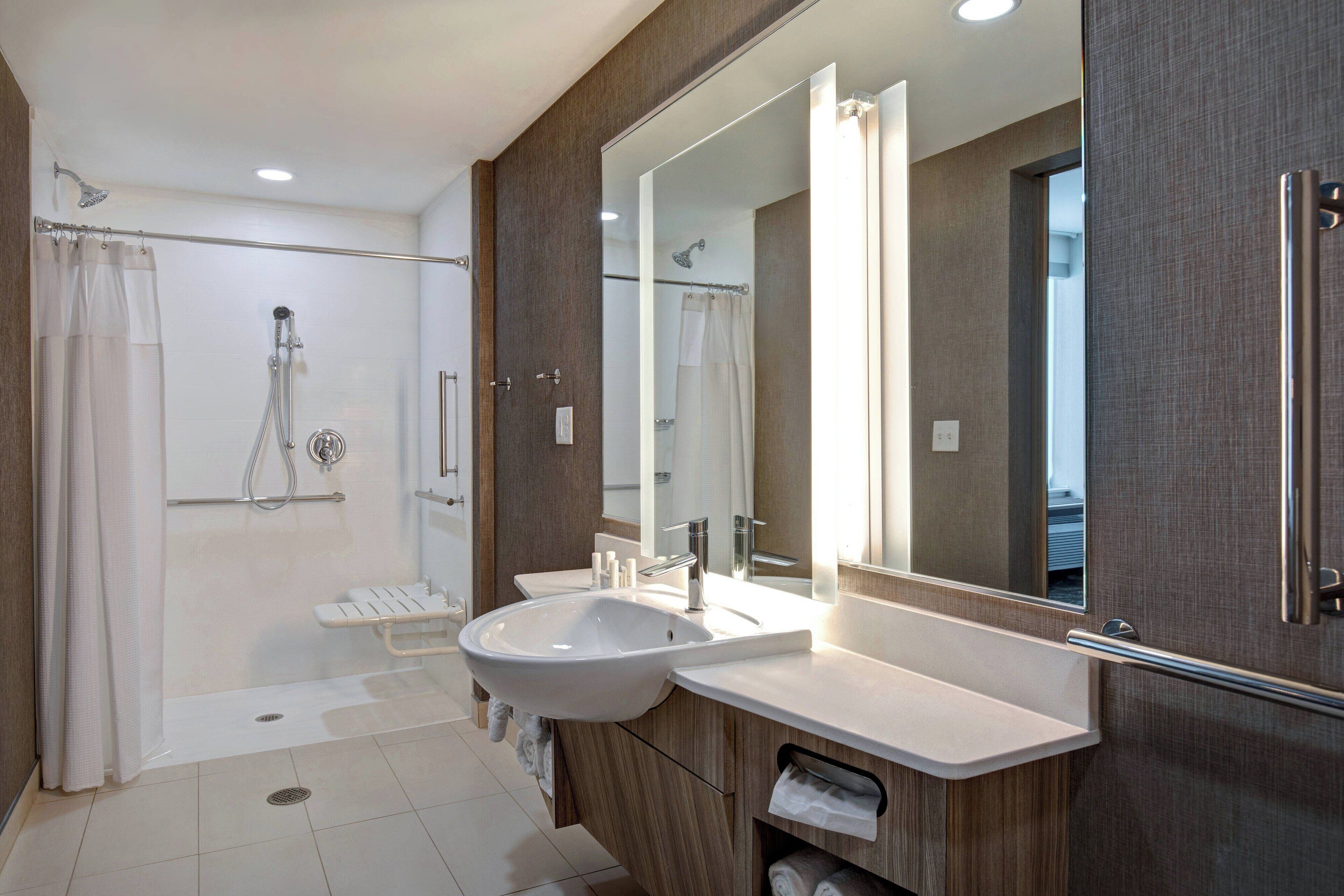 designer toiletries, hair dryer, towels, soap