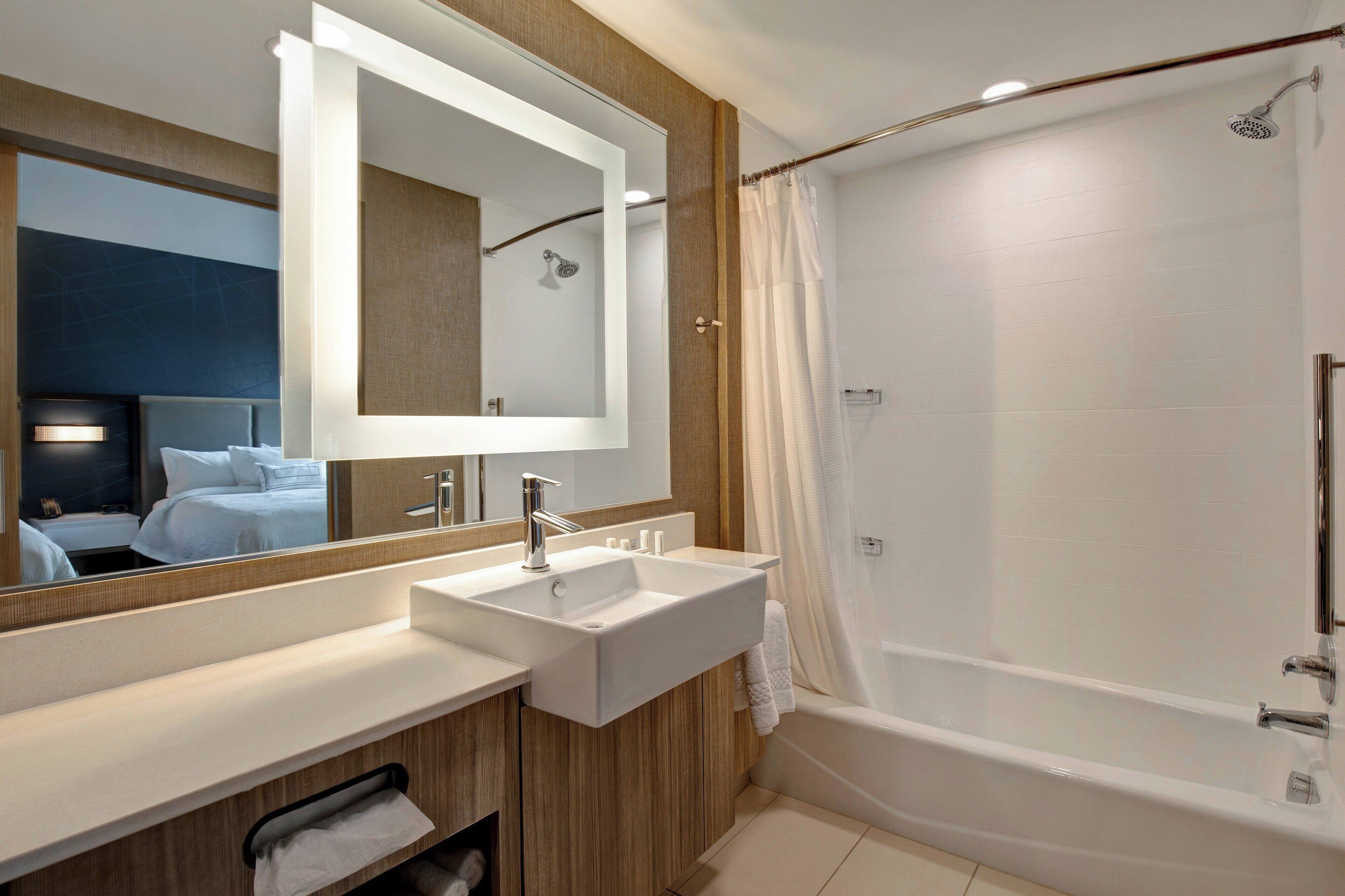 designer toiletries, hair dryer, towels, soap