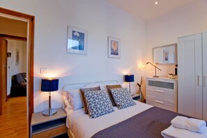 1 bedroom, desk, iron/ironing board, travel cot