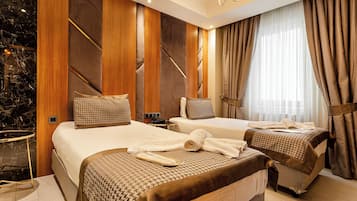 Standard Twin Room | Minibar, in-room safe, soundproofing, iron/ironing board