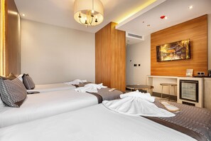 Chambre triple économique | Minibar, coffre-fort, système d’insonorisation