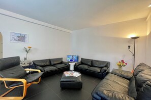 Family Apartment, Multiple Bedrooms (Menaggio 57) | Living area | 24-inch flat-screen TV with cable channels - Menaggio 57 (Menaggio)