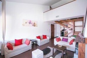 Family Apartment, 3 Bedrooms, 2 Bathrooms, Mountainside (Cadenabbia Fantastico) | Living area | 21-inch flat-screen TV with digital channels, TV, fireplace