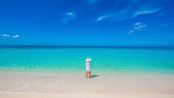 On the beach, sun loungers, beach towels