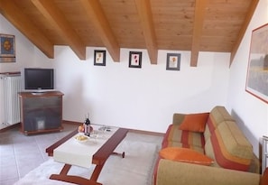 Family Apartment, 1 Double Bed with Sofa bed, Mountainside (Vista d'Oro Ulivo Apt. 16) | Living area | 24-inch TV with digital channels, DVD player, stereo - Vista d'Oro Ulivo Apt. 16 (Perledo)