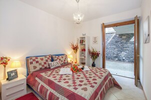 Family Apartment, Multiple Bedrooms, Mountainside (Vista d'Oro Ulivo Apt. 4) | 2 bedrooms, iron/ironing board, WiFi, bed sheets