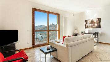 Family Apartment, Multiple Bedrooms, Mountainside (Vista d'Oro Ulivo Apt. 7) | Living room | 24-inch TV with satellite channels, DVD player, stereo