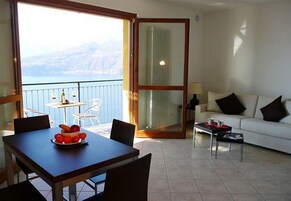 Family Apartment, Multiple Bedrooms, Mountainside (Vista d'Oro Ulivo Apt. 7) | Living area | 24-inch TV with satellite channels, DVD player, stereo